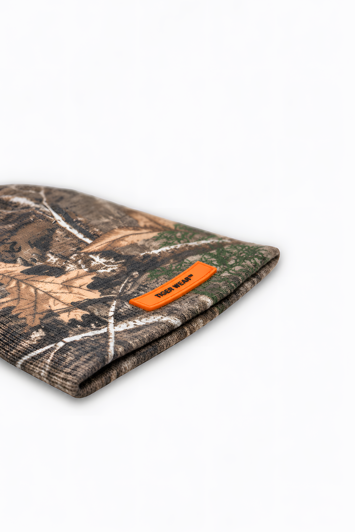 Woodland Pro Beanie by Tigerwear laid flat, side view of the orange PVC label