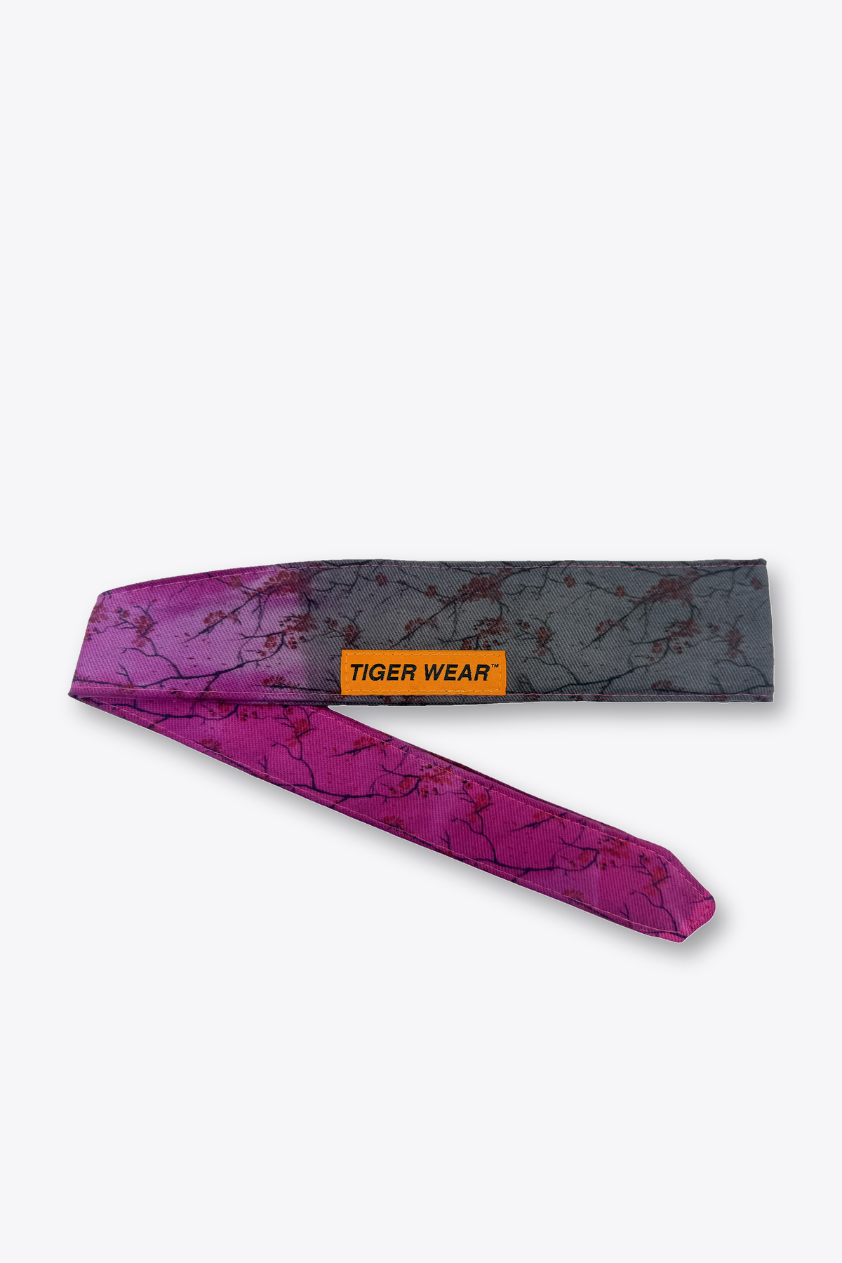 Bloom at Dusk paintball headband by Tigerwear in magenta to charcoal blossom print, tied, showing the tapered tail
