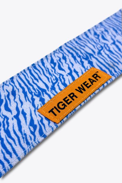 Close up of the orange woven Tiger Wear label on the Cold Front headband, ice blue tigerstripe