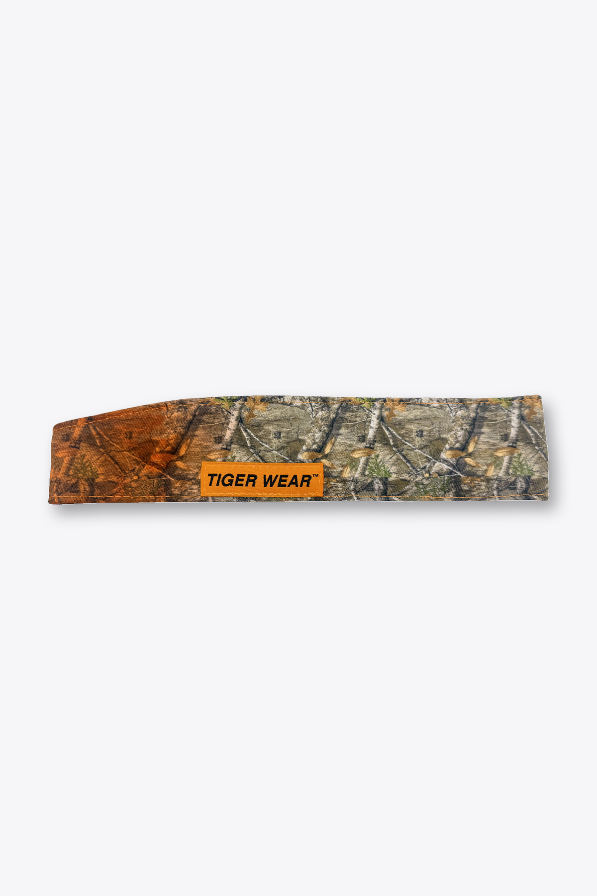 First Light paintball headband by Tigerwear in orange fade timber camo, laid flat with orange woven label