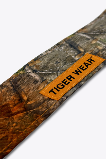 Close up of the orange woven Tiger Wear label on the First Light headband, orange fade timber camo