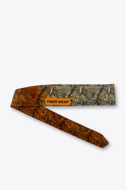 First Light paintball headband by Tigerwear in orange fade timber camo, tied, showing the tapered tail