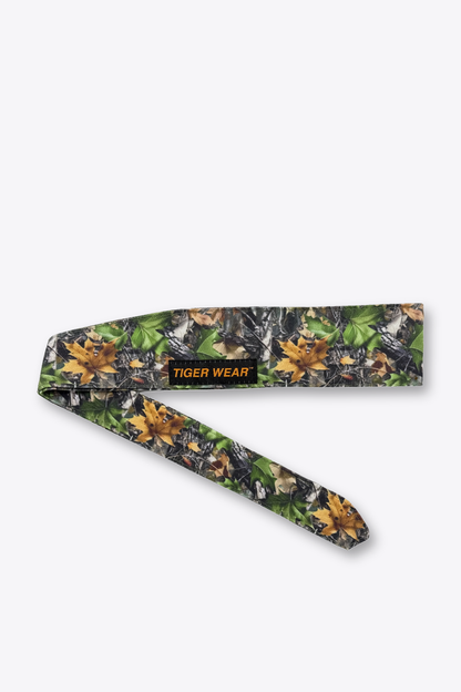 Green timber camo Blacklist paintball headband tied, showing the tail