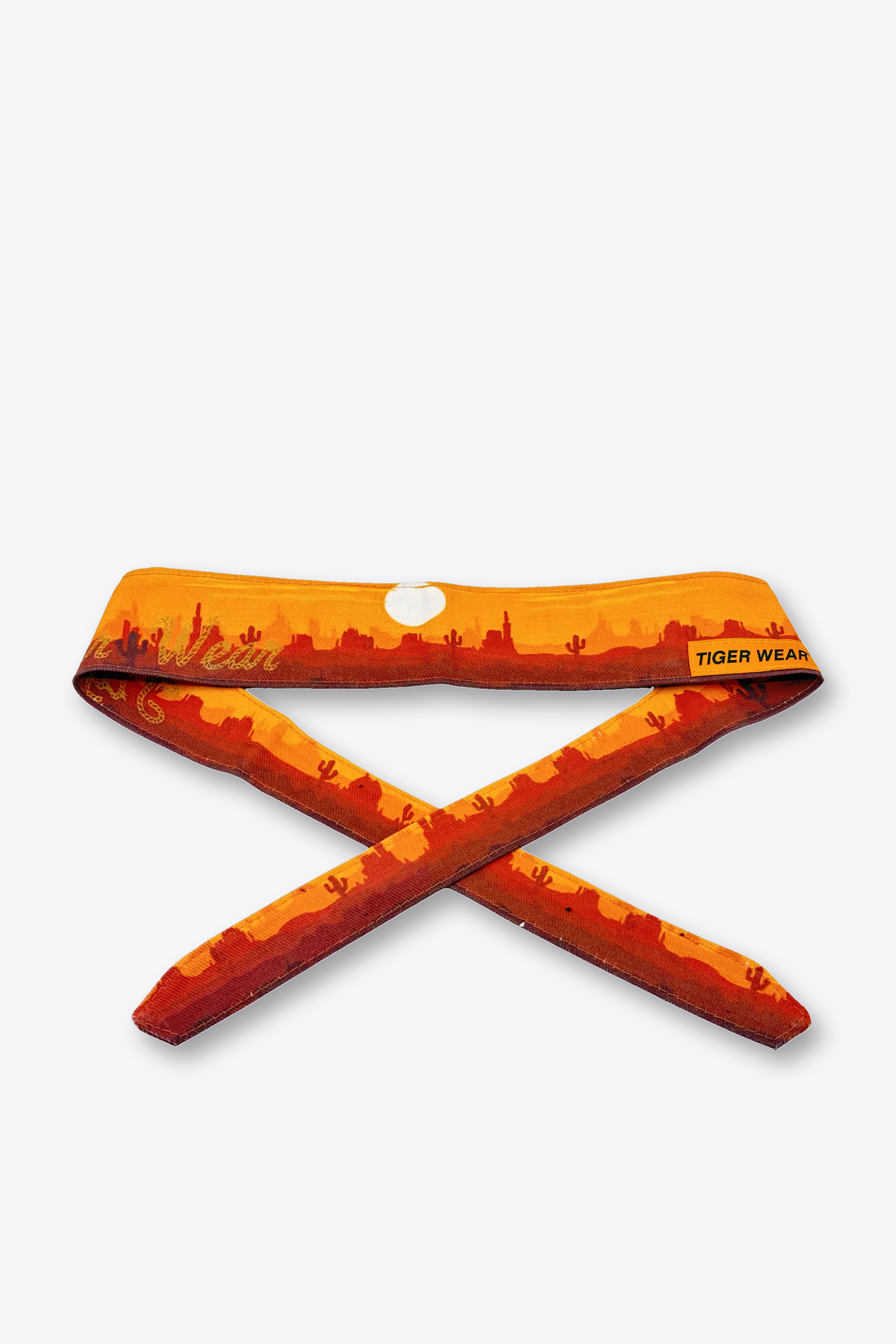 High Noon paintball headband by Tigerwear in orange desert sunset print, tied, showing the tapered tail