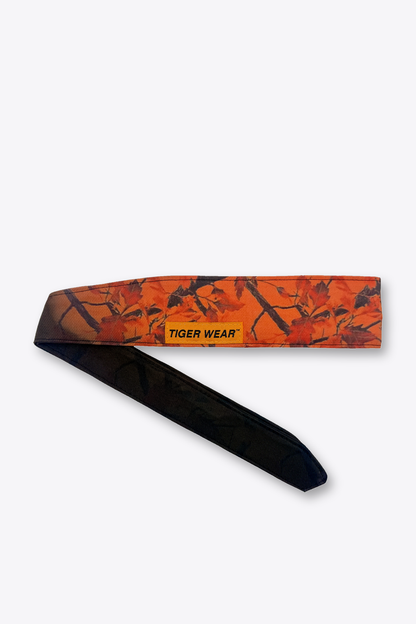 Opening Day paintball headband by Tigerwear in blaze orange leaf camo, tied, showing the tapered tail